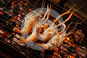 Grilled prawns sold at a street food market stall. Chinatown, Bangkok, Thailand