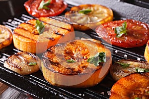 Grilled pumpkin and vegetables on grill pan. Horizontal macro