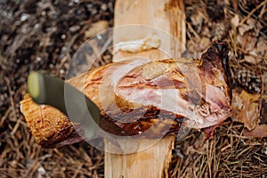 Grilled rabbit meat on wooden board.