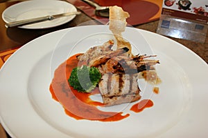 Grilled red snaper and tiger prawn with brocolli