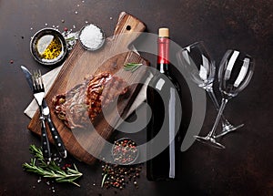 Grilled ribeye beef steak with red wine, herbs and spices