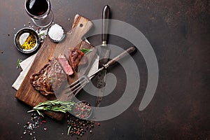 Grilled ribeye beef steak with red wine, herbs and spices