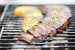 grilled ribs with charred pineapple slices