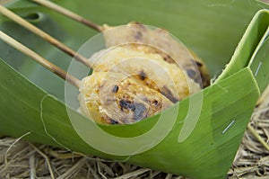 Grilled rice on stick