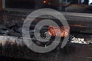Grilled roasted pork meat on charcoal, barbecue. Concept of cooking meat on coals, in restaurant on live fire, on the street