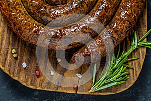 Grilled or Roasted spiral pork sausages with rosemary, salt and peper