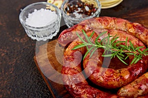 Grilled or Roasted spiral pork sausages with rosemary