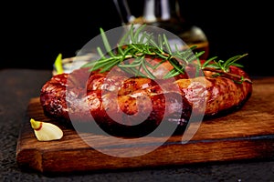 Grilled or Roasted spiral pork sausages with rosemary, salt and peper