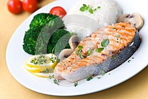 Grilled salmon with broccoli rice and tomato- clos