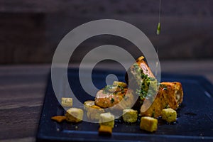 Grilled salmon with croutons