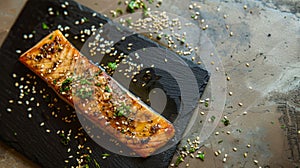 Grilled Salmon Fillet Topped with Sesame Seeds on Slate