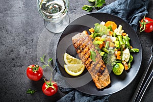 Grilled salmon fillet with vegetables mix.