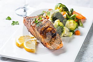 Grilled salmon fillet with vegetables mix.
