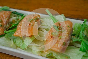 Grilled Salmon with fresh salad and lemon. Selective focus