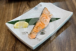 Grilled salmon on grill  with lemon. Fried salmon steak. Japanese Salmon Grilled Salmon Shio Yaki