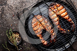 Grilled salmon on iron grill grate