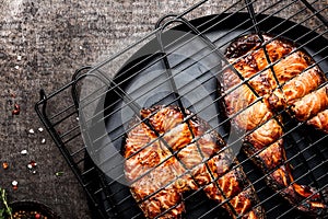 Grilled salmon on iron grill grate