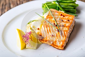 Grilled Salmon. Salmon fillet with lemon and green beans. Grilled fish