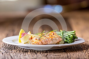 Grilled Salmon. Salmon fillet with lemon and green beans. Grilled fish