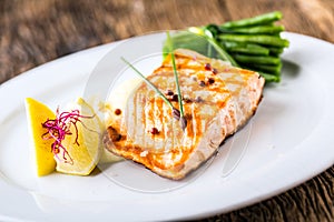 Grilled Salmon. Salmon fillet with lemon and green beans. Grilled fish