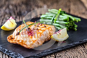 Grilled Salmon. Salmon fillet with lemon and green beans. Grilled fish