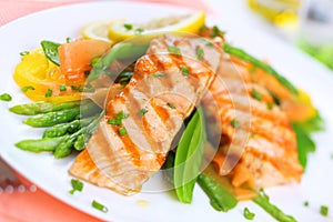 Grilled salmon with spring vegetables, soft focus