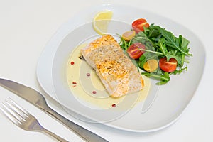 Grilled salmon steak with beurre blanc sauce photo