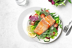 Grilled salmon steak and vegetable salad