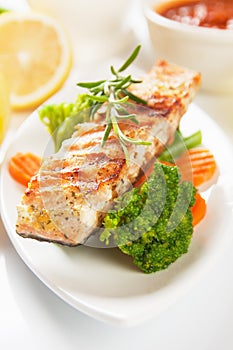 Grilled salmon steak and vegetables