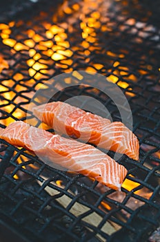 Grilled salmon steaks on a grill. Fire flame grill. Restaurant and garden kitchen. Garden party. Healthy dish.