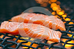 Grilled salmon steaks on a grill. Fire flame grill. Restaurant and garden kitchen. Garden party. Healthy dish.