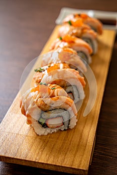 grilled salmon sushi roll with sauce