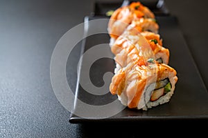 grilled salmon sushi roll with sauce