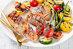 Grilled salmon and vegetables on a plate