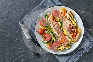 Grilled salmon and vegetables on a plate