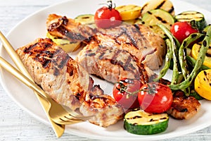 Grilled salmon and vegetables on a plate