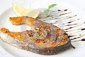 Grilled salomon steak with lemon