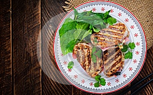 Grilled sandwich panini with ham, tomato, cheese and spinach