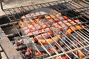 Grilled sausage on barbecue, grill. Shallow depth of field