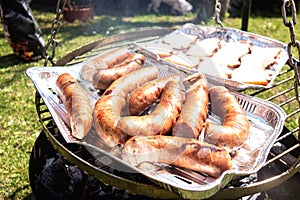 Grilled sausage on the barbecue picnic grill
