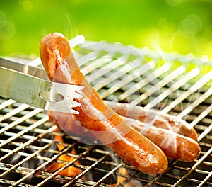 Grilled Sausage on the flaming Grill