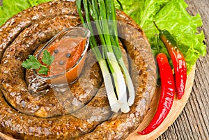 Grilled sausage (kielbasa) closeup photo