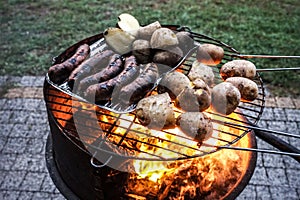 Grilled sausage and potaoes, barbecue