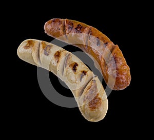 Grilled sausage steak isolated on the black background with clipping path