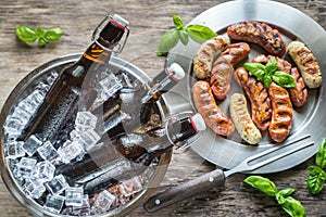 Grilled sausages with bottles of beer