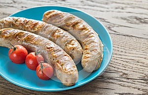 Grilled sausages with cherry tomatoes