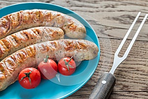 Grilled sausages with cherry tomatoes
