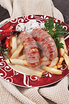 Grilled sausages with french fries