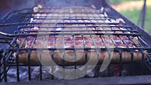 Grilled sausages are fried and smoked in charcoal grills. Sausages in a natural shell.