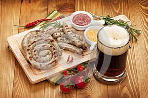 Grilled sausages with mug of beer